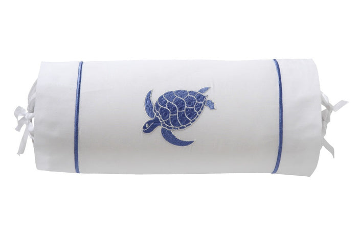 White cylindrical pillow with blue turtle design on a white background