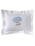 White pillowcase with floral embroidery on a white background