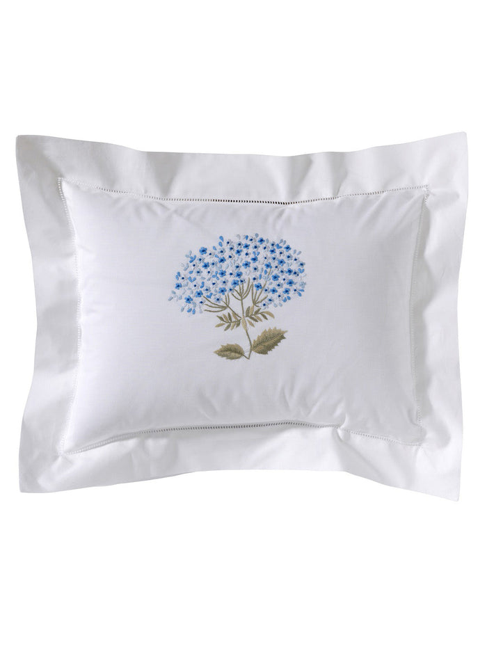 White pillowcase with floral embroidery on a white background