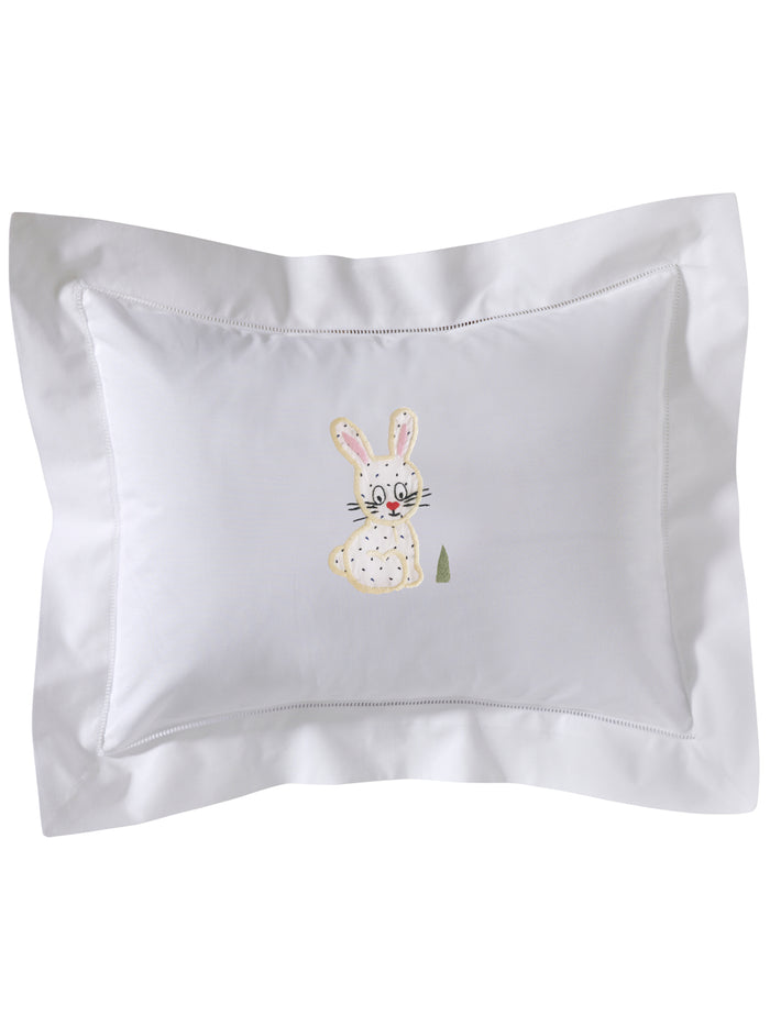 Embroidered bunny design on a white pillowcase