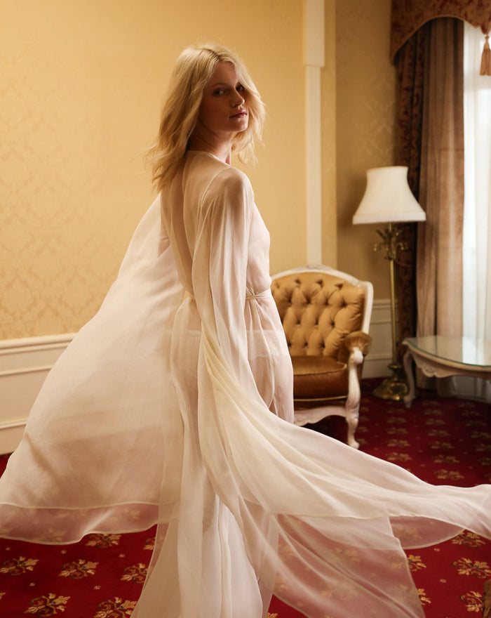 Mid-length shot highlighting the airy texture and graceful movement of the delicate 100% mulberry silk fabric.