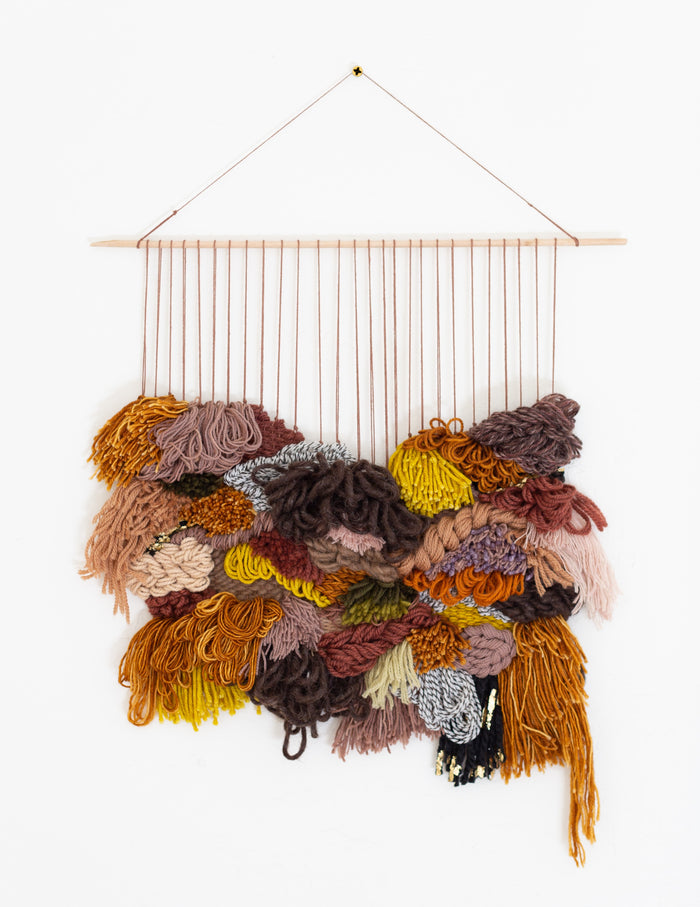 Full view of Cedarville textile wall hanging — warm earthy woven decor with fringe and dimensional fiber layers.