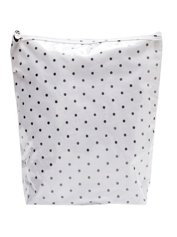 White pouch with black polka dots on a white background