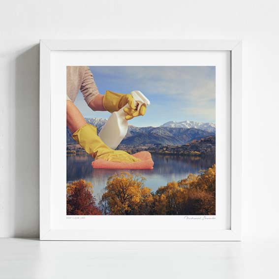 Close-up detail of Deep Clean Lake art print. Gloved hands polishing a scenic lake landscape, thought-provoking surreal nature wall decor for offices and galleries