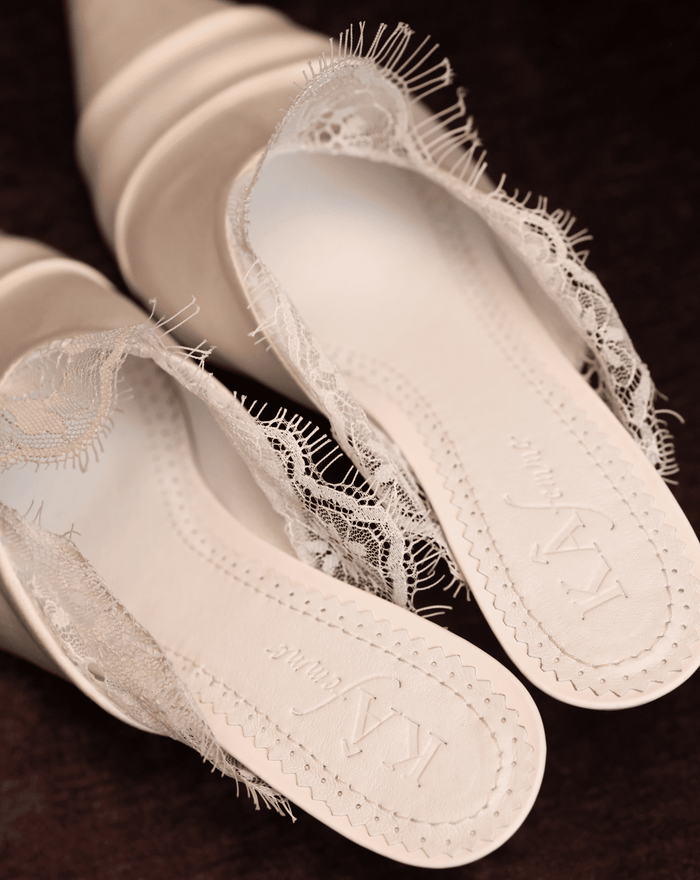 A clear view of the genuine leather insole featuring the brand logo and soft padding for long-wearing comfort.