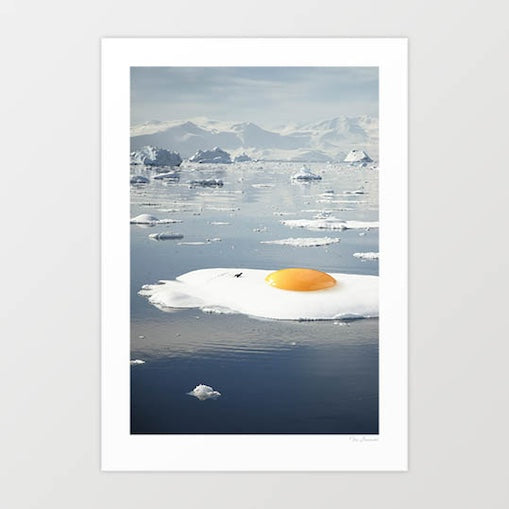 Surreal art print of a sunny-side-up egg melting on an iceberg — quirky climate change wall art for kitchens and modern interiors