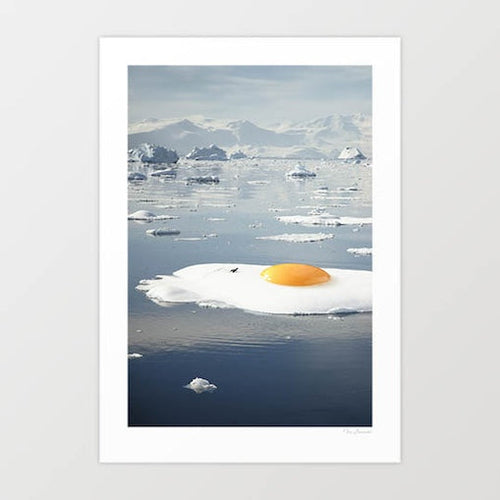 Surreal art print of a sunny-side-up egg melting on an iceberg — quirky climate change wall art for kitchens and modern interiors