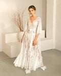 Full-length shot of the model in the Flora nightdress, with the hem flowing beautifully to showcase its voluminous design.