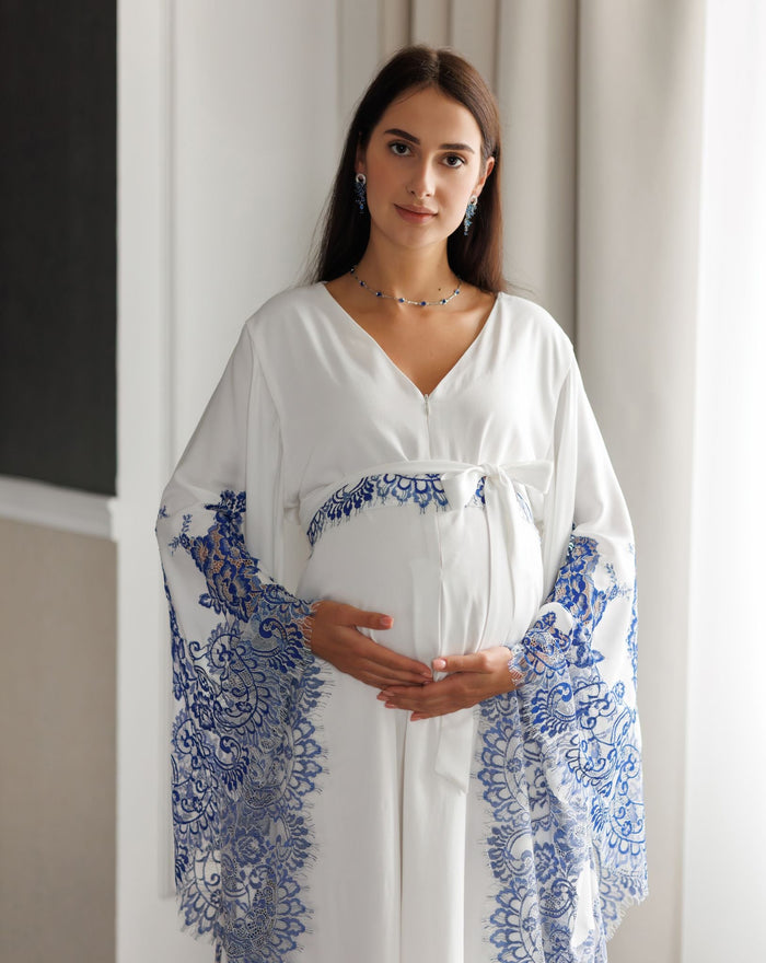 Frontal mid-length view of a woman holding her belly, showcasing the breathable cotton-blend fabric of the garment.