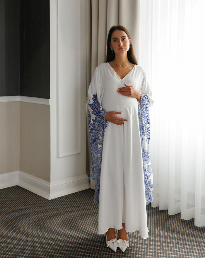 Full-length standing view of the Maternity Kaftan, illustrating its graceful silhouette and weightless feel.