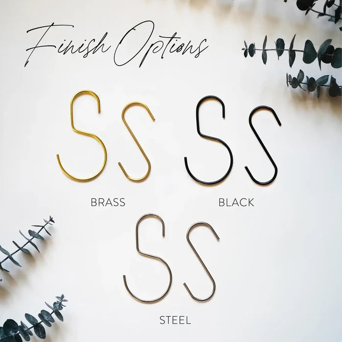 Hook style comparison chart showing different metal finishes — minimalist wall hook options designed to pair with leather loops and wood rails.