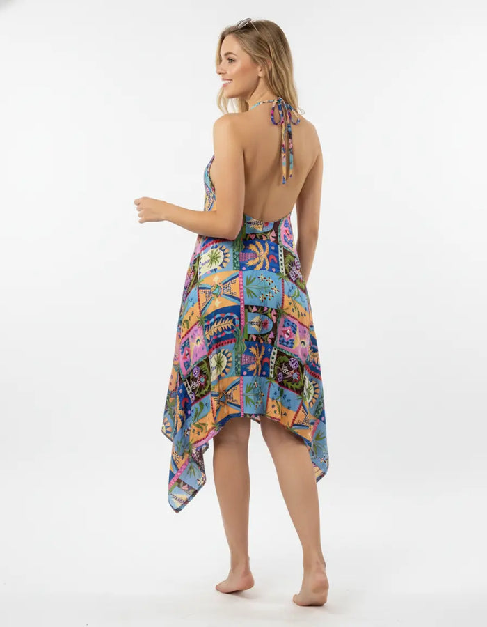 Woman wearing a colorful patchwork dress on a white background