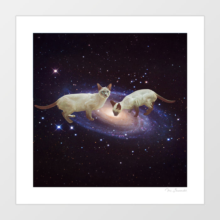 Surreal cosmic art print of two Siamese cats floating weightlessly in deep space above a glowing spiral galaxy and blue-white nebula – Interstellar Lickers Milky Cat Lap by Vertigo Artography
