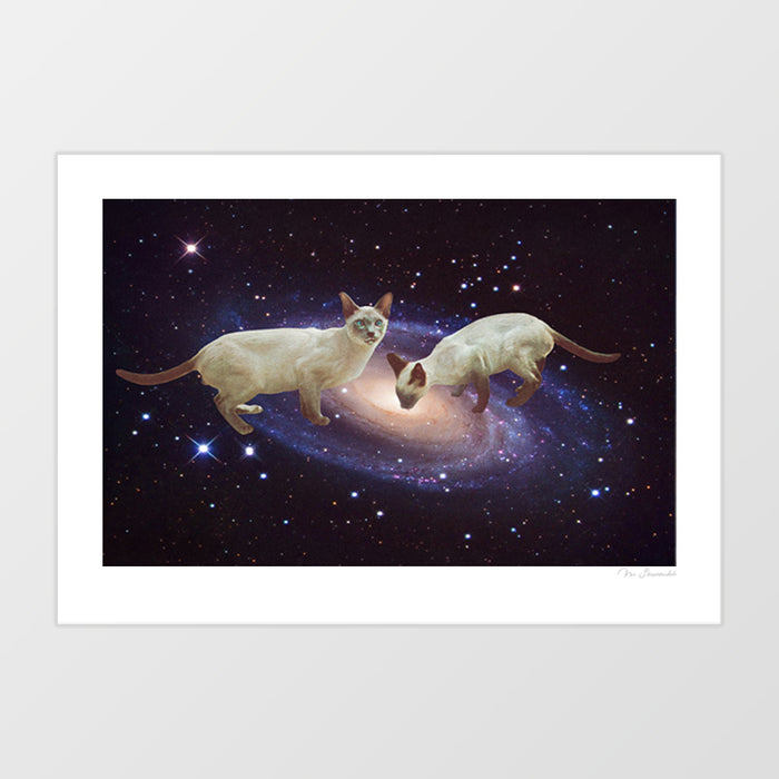 Whimsical space cat wall art print featuring two Siamese cats lapping up the Milky Way galaxy against a starry deep space background – surreal cosmic cat poster and funny cat lover gift by Vertigo Artography