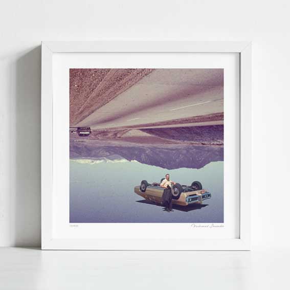 Close-up detail of Joyride art print — gravity-defying classic car on inverted highway, bold surreal wall decor for creative studios and offices