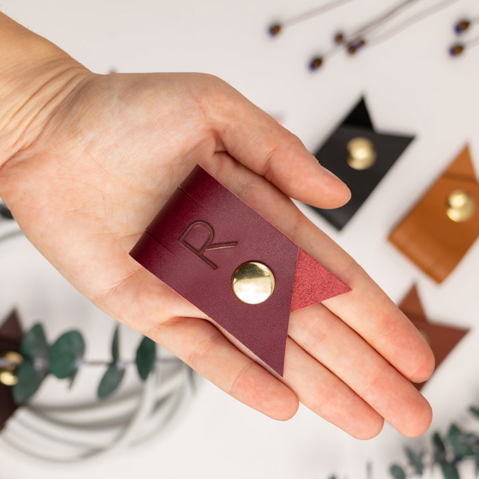 Handcrafted Wine leather large cable holder with customized R letter and brass snap closure, durable cord organizer for charging cables, computer cords, electronics storage and everyday tech organization by Keyaiira