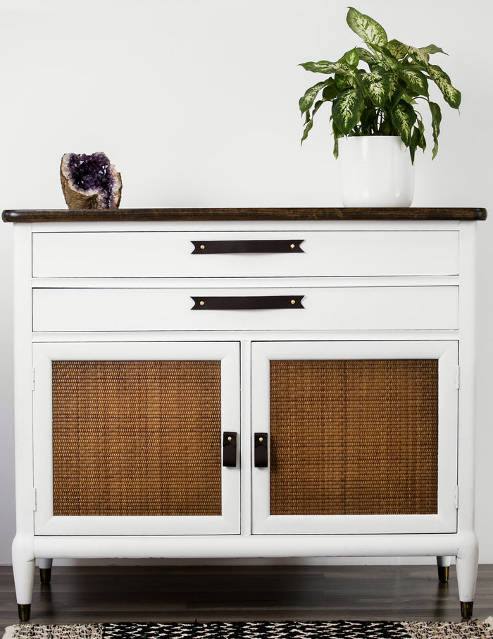 Keyaiira black leather cabinet handles installed above woven cane cabinet doors modern leather drawer pulls with brass hardware.