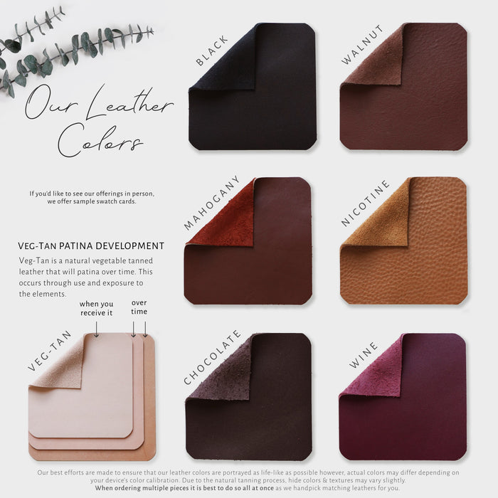 Keyaiira Leather Sample Cards stacked color swatch sheets featuring veg-tan, nicotine, walnut, mahogany, chocolate, and black leathers with natural texture variations. Shown with eucalyptus for a minimal product presentation.