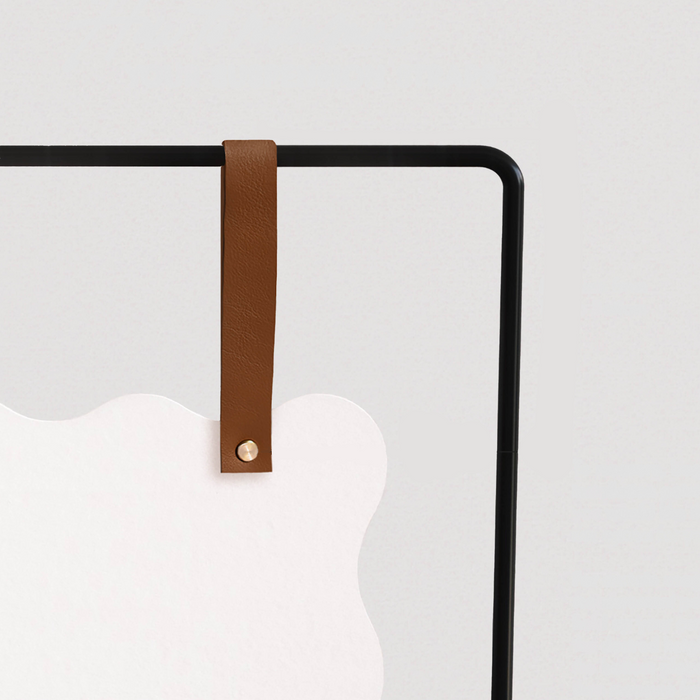 Keyaiira leather signage strap showcasing modern event entrance sign on garden frame with elegant natural materials.
