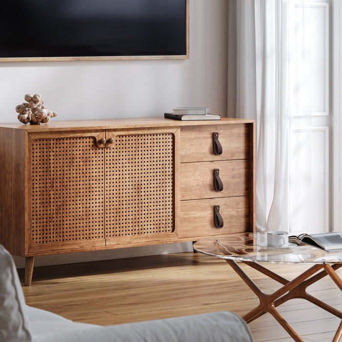 Keyaiira chocolate brown leather drawer pulls on a mid-century wood and rattan sideboard, artisan-made leather loop handles with brass screws for a warm, modern living room accent.