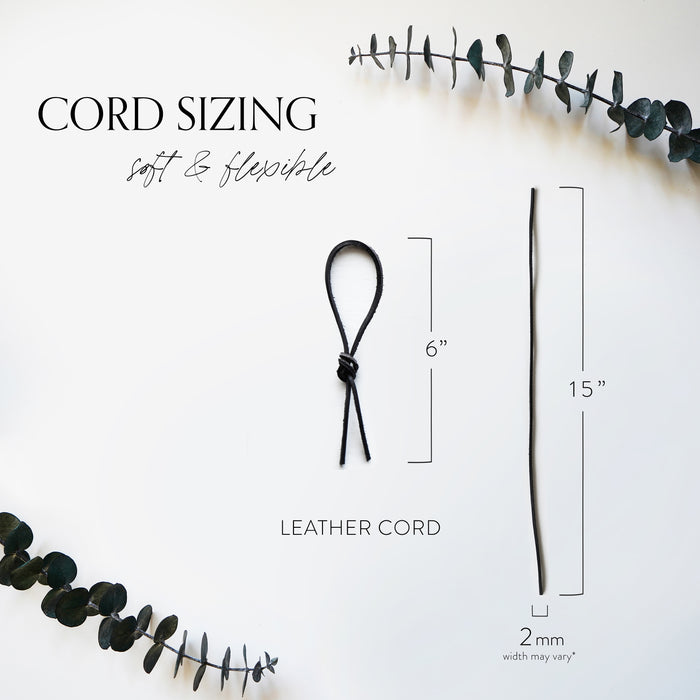 Leather Napkin Tie sizing guide from Keyaiira. Shows soft, flexible leather cord dimensions: 15 inches long and 2mm wide. Each sustainable byproduct leather cord is cut and finished by hand for modern table styling.