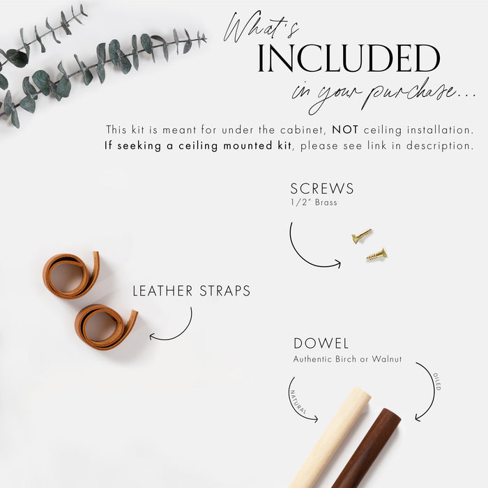 Paper towel holder components included — leather straps, wood dowel rod, mounting hardware, and installation guide.
