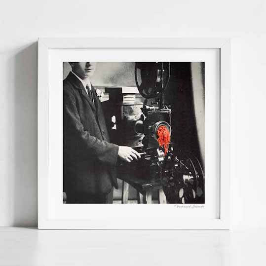 Reel Mince art print framed square — surreal vintage collage of a professional film projector with bright red raw mince threaded through the mechanism in a black and white industrial photograph, colour pop cinema food pun print for home theatres creative studios and gallery walls
