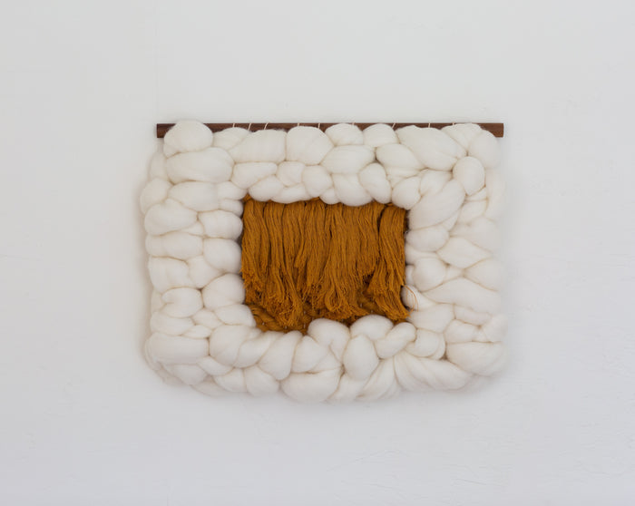 Sesame Cloud rectangular fiber wall sculpture mounted on white wall — minimalist mixed-media textile art in warm neutral palette.