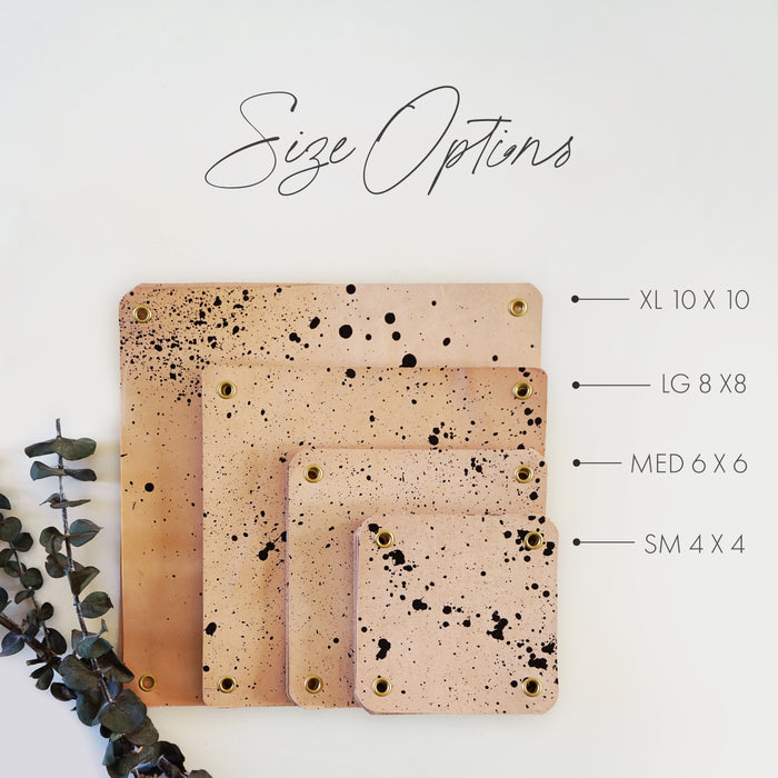 Keyaiira leather hanging planter size chart showing four handcrafted speckled leather pieces labeled small, medium, large, and extra large. Visual guide of natural vegetable-tanned leather sizing for modern hanging planters.