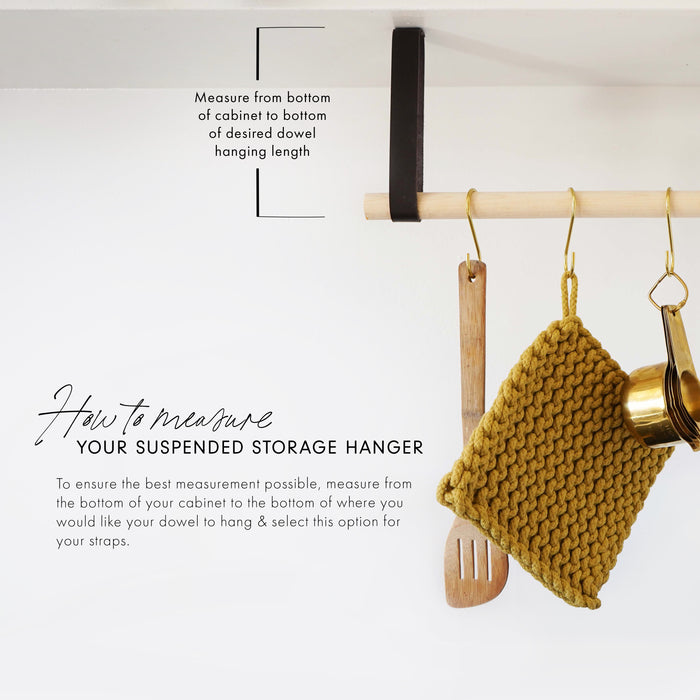 Kitchen wall rail installation guide showing included components — leather straps, wood dowel, brass hooks, and mounting hardware.