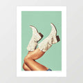 Surreal art print of white glitter cowboy boots with legs kicked in the air against a sage green background – These Boots Glitter Green by Vertigo Artography