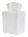 White tissue box with tissues on a white background