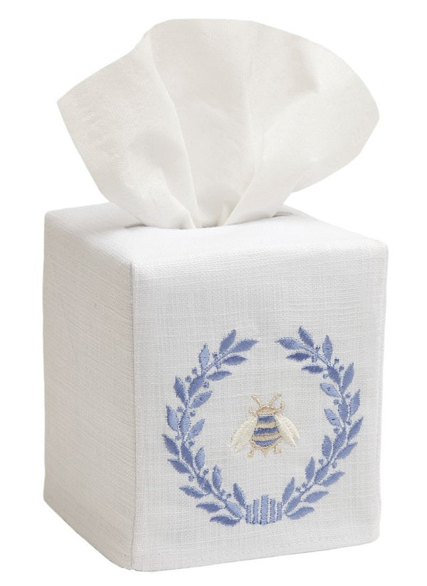 Tissue box cover with embroidered design on a white background