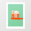 Toothpaste Cat art print — small white cat sitting neatly on the bristles of an oversized orange toothbrush against a mint green background, surreal minimalist funny cat wall art for bathrooms and cat lovers