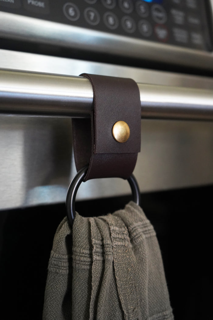 Eco friendly towel ring made from byproduct nicotine colored leather, artisan made kitchen accessory with black ring from Keyaiira.
