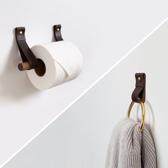 Keyaiira leather towel ring and toilet paper holder bundle mounted on a neutral wall. Handcrafted leather with brass hardware adds modern warmth and minimal style to bathroom decor.