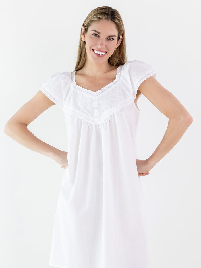 Woman wearing a white nightgown on a white background